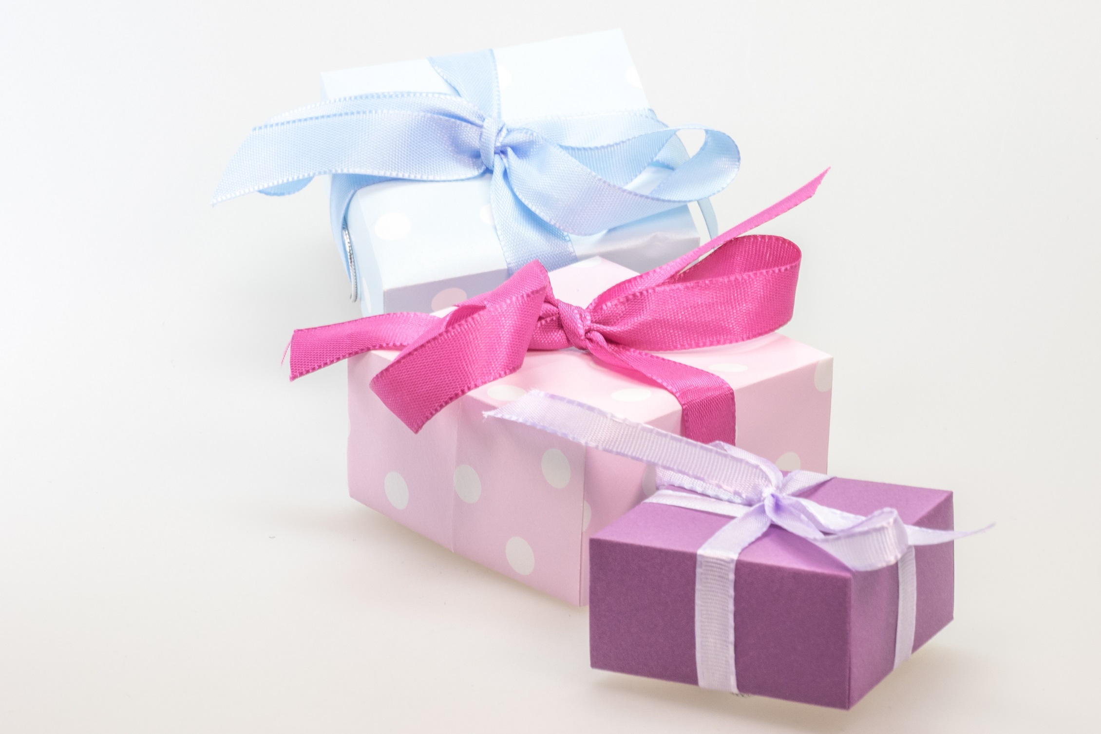 wrapped blue, pink and violet gift boxes